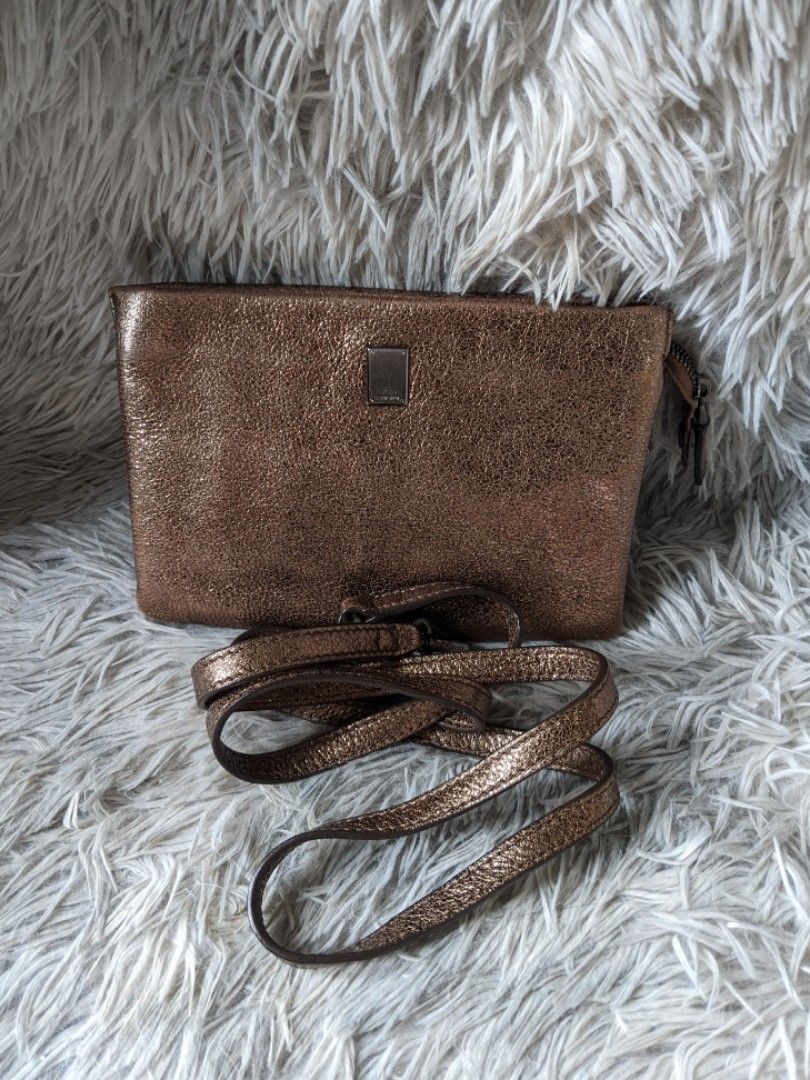 Couronne Metallic Wallet Sling Bag (Category: Luxury Bags & Wallets) located in Makati City. Submitted by zzzzainab (Listing ID 1211685364, Image 1). Description: Preloved bag from Korea Gunmetal hardware Bronze leather With code and original sling! So pretty! Please refer to pictures for any flaws.