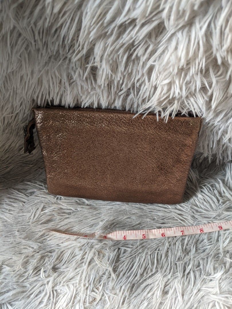 Couronne Metallic Wallet Sling Bag (Category: Luxury Bags & Wallets) located in Makati City. Submitted by zzzzainab (Listing ID 1211685364, Image 3). Description: Preloved bag from Korea Gunmetal hardware Bronze leather With code and original sling! So pretty! Please refer to pictures for any flaws.