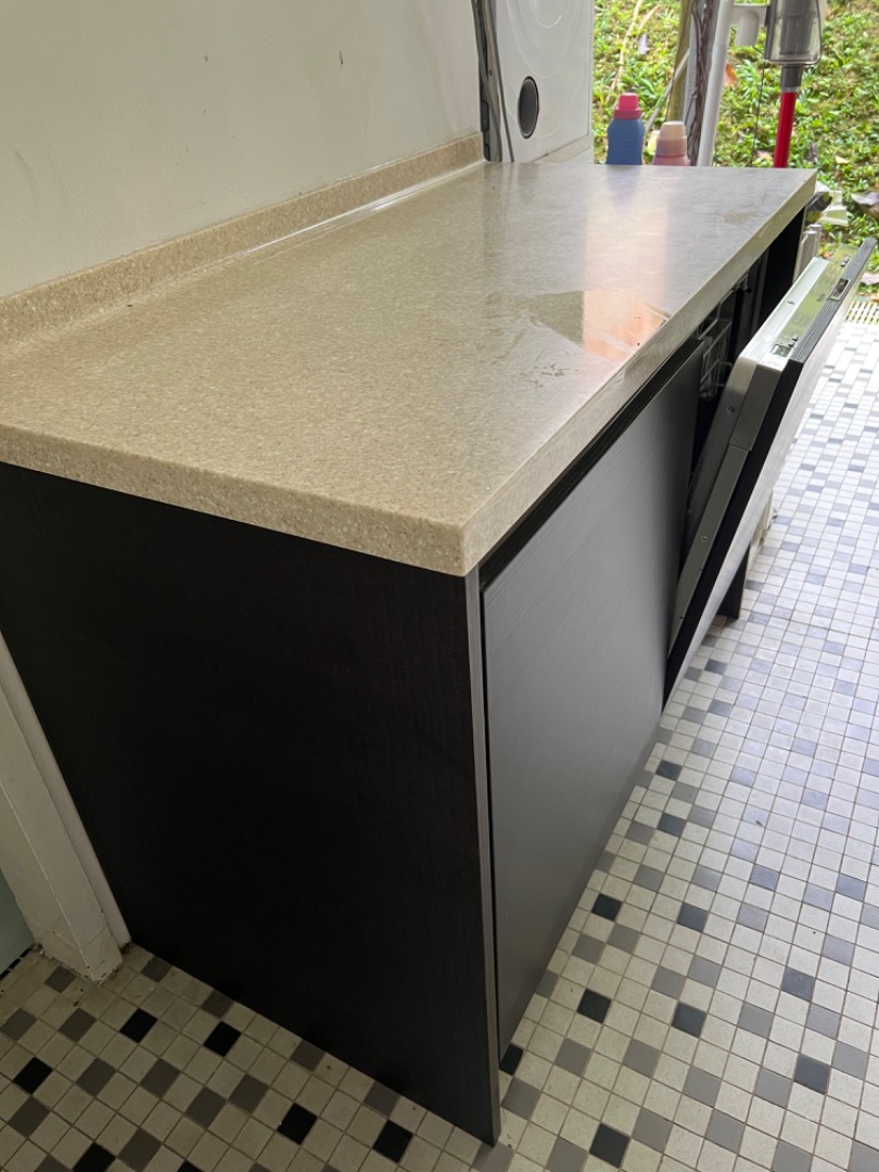 Kitchen units with Corian worktops and integrated Miele dishwasher