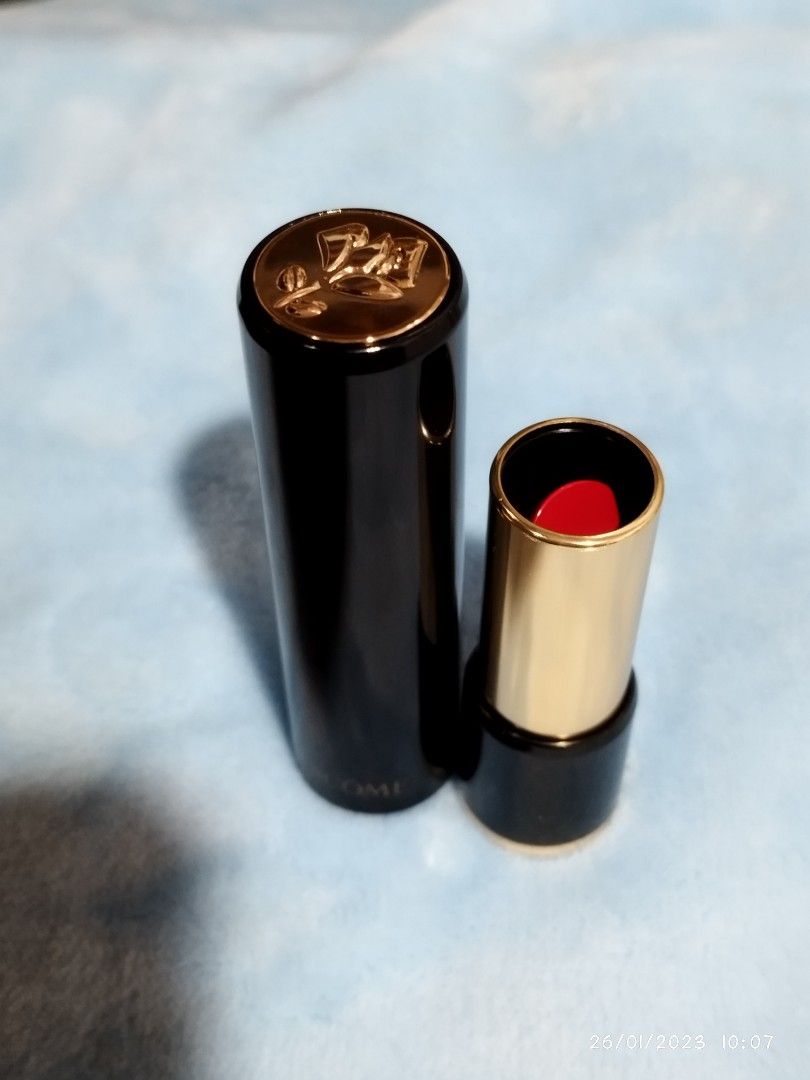Lancome Lipstick (Category: Makeup) located in Guiguinto. Submitted by clayne30 (Listing ID 1211557766, Image 3). Description: ORIGINAL LANCOME LIPSTICK Bought it at Canada SHADE CAPRICE 132 Red color actual press the flower on the top and it will open the lipstick unique style.