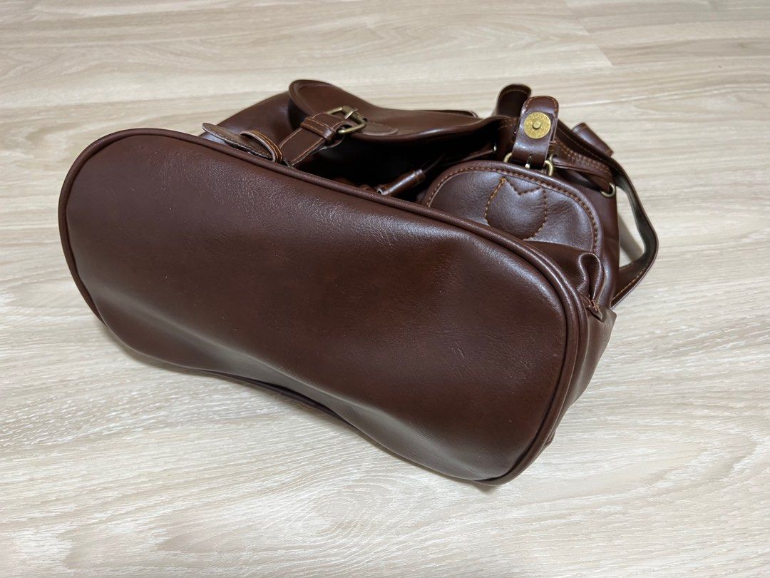 Small backpack (Category: Backpacks) located in Singapore. Submitted by pigami (Listing ID 1211744940, Image 2). Description: Details: •Measurement: 28Lx17W(Base)x29H •Made in Thailand •Soft feel even though PVC, well constructed brown bag (colour is dark brown, more accurate in 2nd pic) •One internal pocket •Brand new in plastic bag Self collect at Postal code 322004.