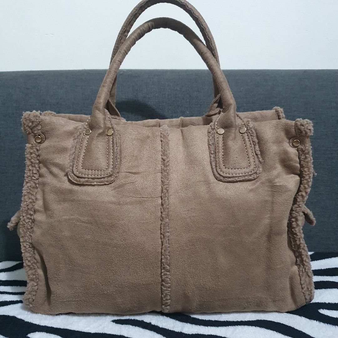 Hermes-inspired Soft Tote Bag (Category: Tote Bags) located in Pasig City. Submitted by _bcgs_ (Listing ID 1212021820, Image 2). Description: medium-sized cloth material (like soft flanel) with faux fur on the edges already washed so it is ready to use no flaws or stains or any other issues 💯 hardwares are still like new.