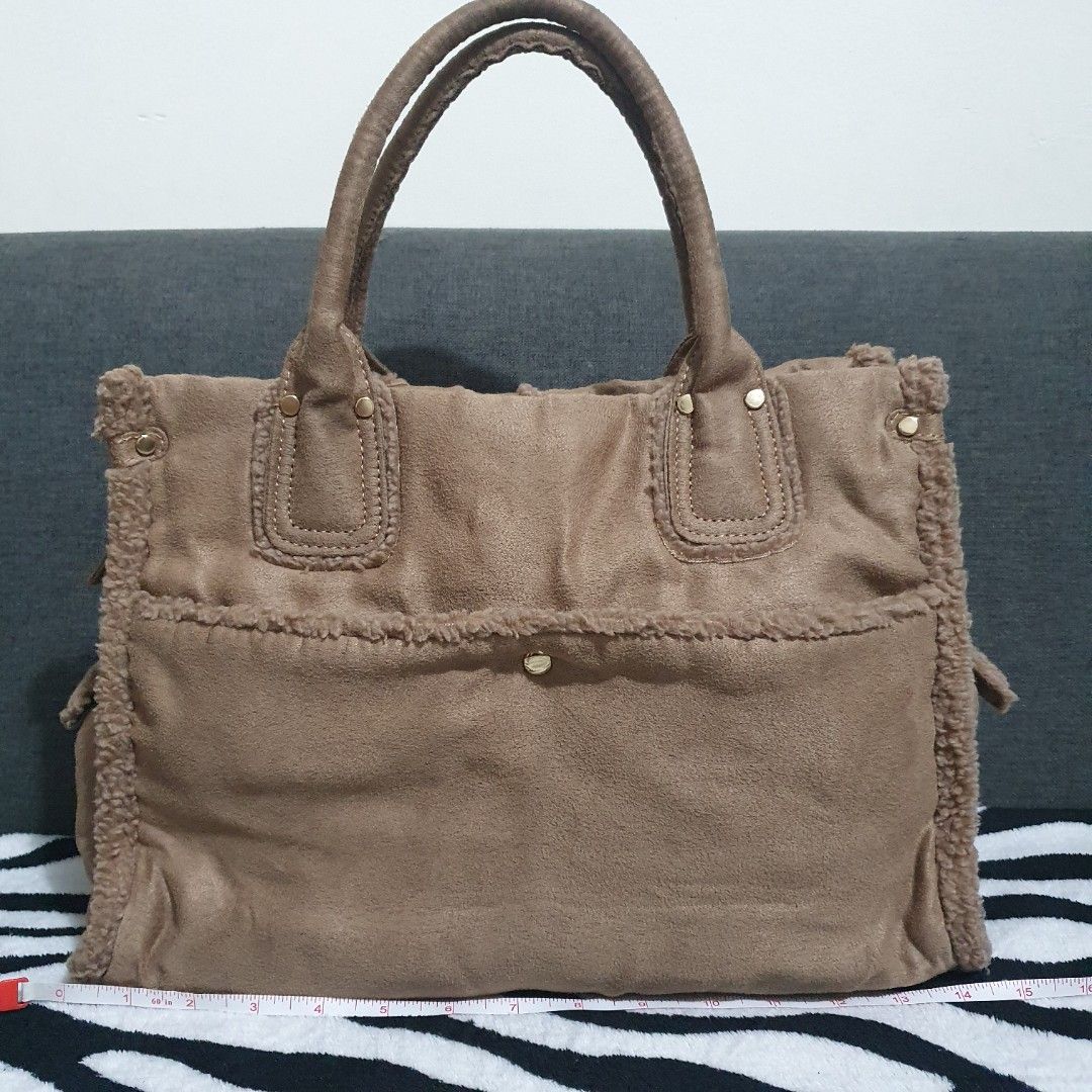 Hermes-inspired Soft Tote Bag (Category: Tote Bags) located in Pasig City. Submitted by _bcgs_ (Listing ID 1212021820, Image 1). Description: medium-sized cloth material (like soft flanel) with faux fur on the edges already washed so it is ready to use no flaws or stains or any other issues 💯 hardwares are still like new.