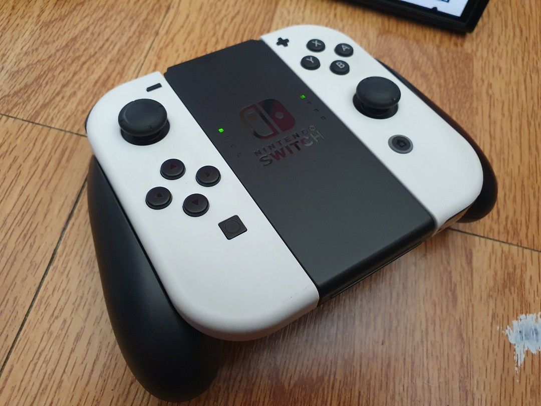 Switch Oled (like new) (Category: Nintendo) located in Manila. Submitted by kiddgamer (Listing ID 1212045568, Image 2). Description: 🔥Switch Oled (Mint Condition) 15,500 only🔥 Complete accessories with 1 game Can be picked up or delivered thru Lbc Grab or Lalamove Check my feedback for confidence in buying..