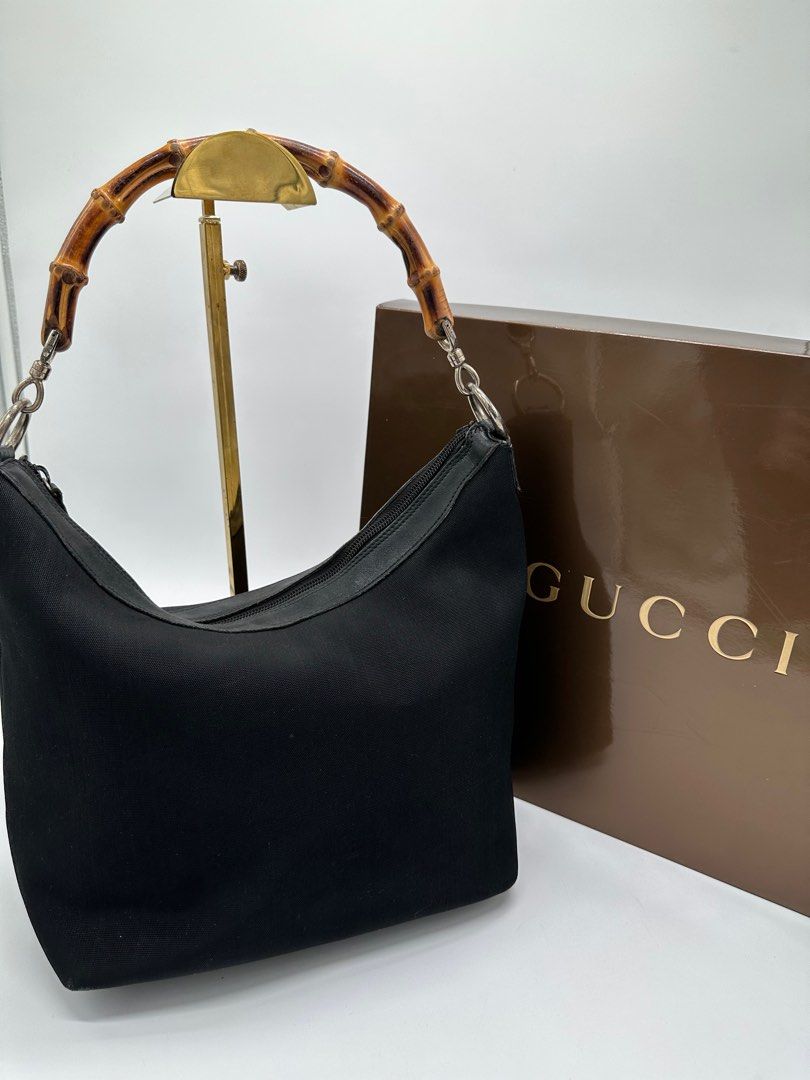 Vintage Gucci In Bamboo handle (Category: Luxury Bags & Wallets) located in Manila. Submitted by davidspreowned (Listing ID 1212055665, Image 1). Description: Gucci Bamboo Handle vintage piece in black color body structure and exterior was still in good shape but the interior needs a bag spa overall this was a good buy no more inclusion.