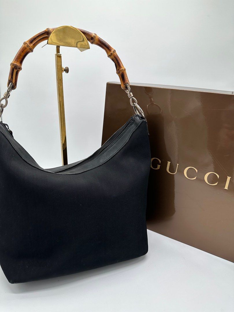 Vintage Gucci In Bamboo handle (Category: Luxury Bags & Wallets) located in Manila. Submitted by davidspreowned (Listing ID 1212055665, Image 3). Description: Gucci Bamboo Handle vintage piece in black color body structure and exterior was still in good shape but the interior needs a bag spa overall this was a good buy no more inclusion.