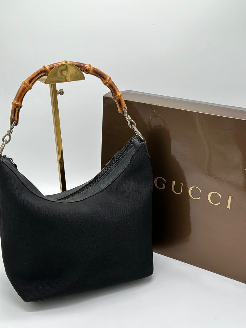 Vintage Gucci In Bamboo handle (Category: Luxury Bags & Wallets) located in Manila. Submitted by davidspreowned (Listing ID 1212055665, Image 2). Description: Gucci Bamboo Handle vintage piece in black color body structure and exterior was still in good shape but the interior needs a bag spa overall this was a good buy no more inclusion.