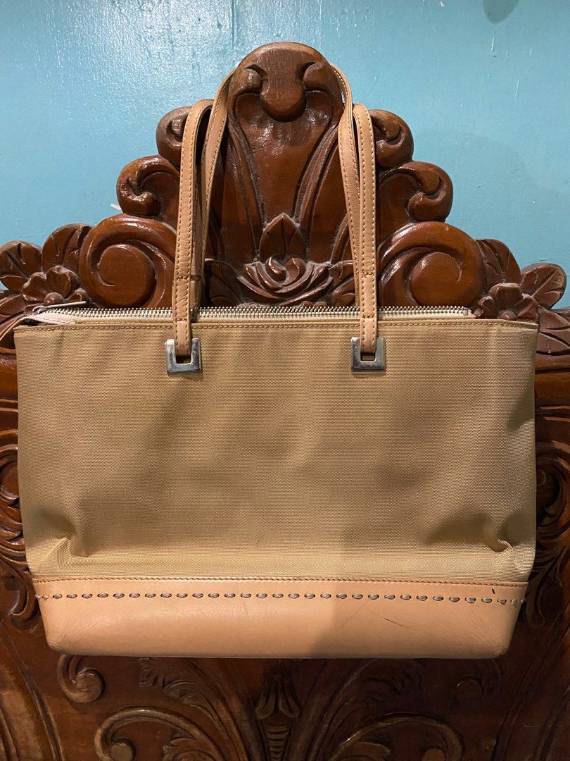 Authentic Courreges Paris bag (Category: Shoulder Bags) located in Pasig City. Submitted by rmark (Listing ID 1212219785, Image 2). Description: Pls look at the flaws Money back if fake Already glue the unattached part of handle which does not affect its durability .