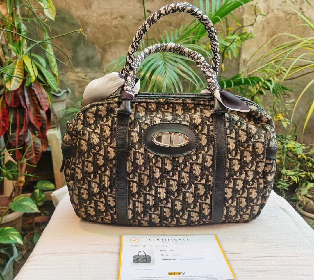 Authentic Dior duffle bag (Category: Luxury Bags & Wallets) located in Muntinlupa City. Submitted by jballsofsteel (Listing ID 1212160110, Image 1). Description: Flaws and imperfections are all declared. Color may vary due to camera and lightings. Manage your expectations when buying pre loved items. with certification of authenticity. Please message me if you have concerns and questions about the item..