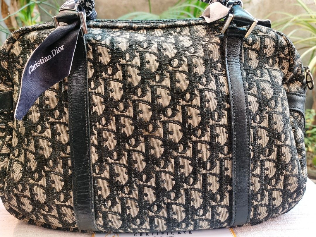Authentic Dior duffle bag (Category: Luxury Bags & Wallets) located in Muntinlupa City. Submitted by jballsofsteel (Listing ID 1212160110, Image 3). Description: Flaws and imperfections are all declared. Color may vary due to camera and lightings. Manage your expectations when buying pre loved items. with certification of authenticity. Please message me if you have concerns and questions about the item..