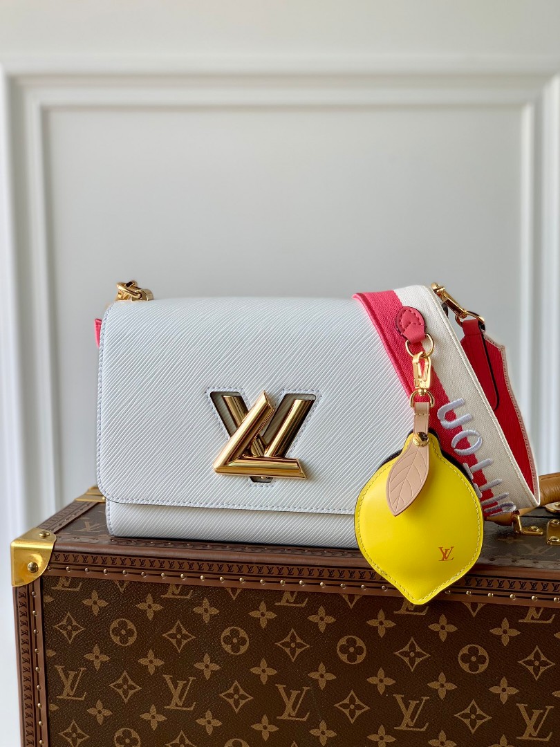 who is louis Louis Vuitton Vintage Key Holder and Bag Charm Lemon