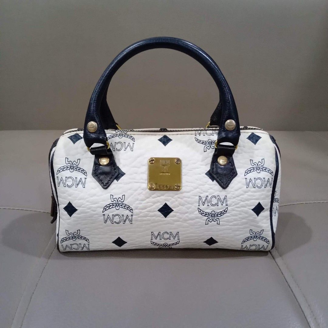 MCM Mini Boston White Sling Bag (Category: Luxury Bags & Wallets) located in Taguig. Submitted by esa.agustin (Listing ID 1207327234, Image 2). Description: Oroginal MCM white pvc leather mini boston sling bag. Size 18 cm. Made in Germany..