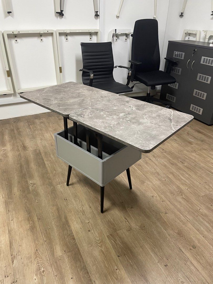 Multi-Function Coffee Table (Category: Tables & Sets) located in Singapore. Submitted by bokmu26 (Listing ID 1207178287, Image 1). Description: * Existing Stock only available in one color. Material: Laminate / Plywood Size: 500L x 550D x 528H (mm) when Closed 1000L x 500D x 725H (mm) when Open Delivery Charge: $80 No delivery charge for self-collection..