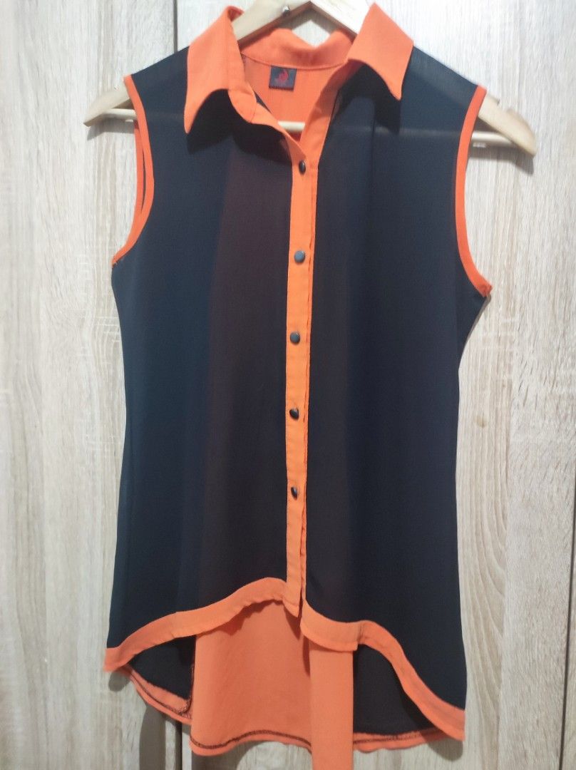 Two tone black and orange blouse (Category: Sleeveless) located in Taguig. Submitted by swiftgem (Listing ID 1212318539, Image 3). Description: sleeveless black and orange top long back no noticeable flaws Bagay na i-tuck in sa pants casual top xs to small fashionista look if paired with denim shorts RFS: Decluttering.