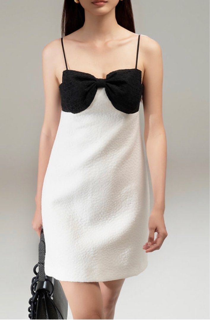 White dress with black ribbon top