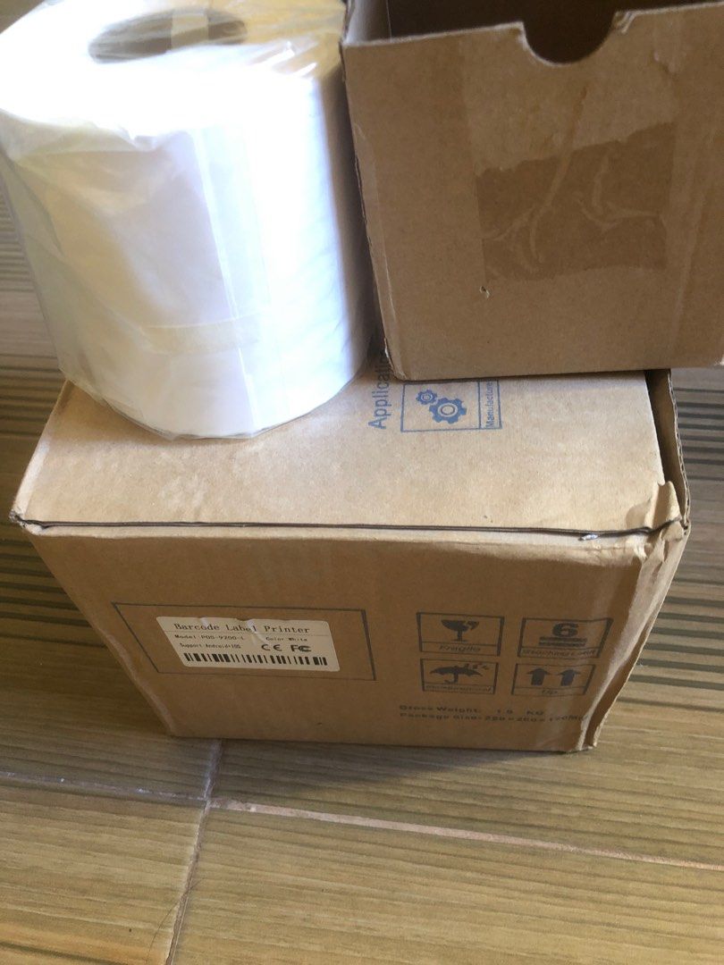 Label Printer + holder & Thermal sticker paper (Category: Printers, Scanners & Copiers) located in Pasig City. Submitted by clearup1 (Listing ID 1212508749, Image 1). Description: Brand new! Barcode Label printer Model: POS-9200-L Color: White Support: Android & IOS Thermal paper A6 100x150 350pcs roll.