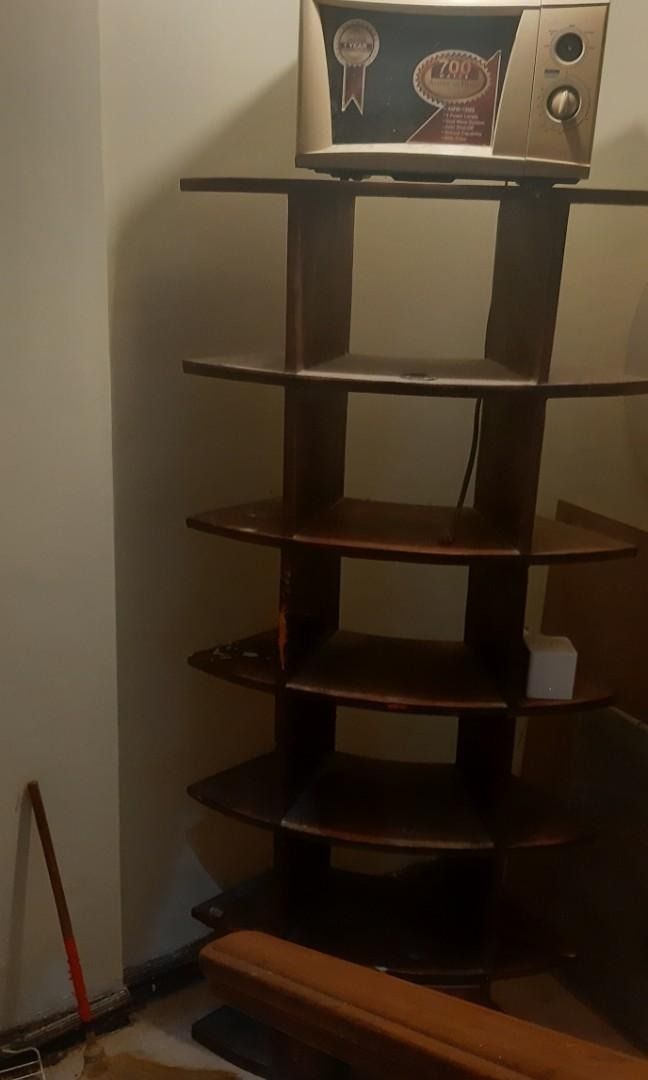 NARRA FURNITURE OPEN SHELF (Category: Shelves, Cabinets & Racks) located in Paranaque City. Submitted by sofiaflrs (Listing ID 1207443795, Image 1). Description: NARRA FURNITURE OPEN CURVED SHELF SEE DIMENSIONS ON THE LAST PICTURE PRICE IS NEGOTIABLE ❗ Color: Brown Material: Narra Condition: 8/10; Used; It hasn't been cleaned because there are still some stuff stored but will be cleaned once we find a legitimate buyer Problem: There's a splash of