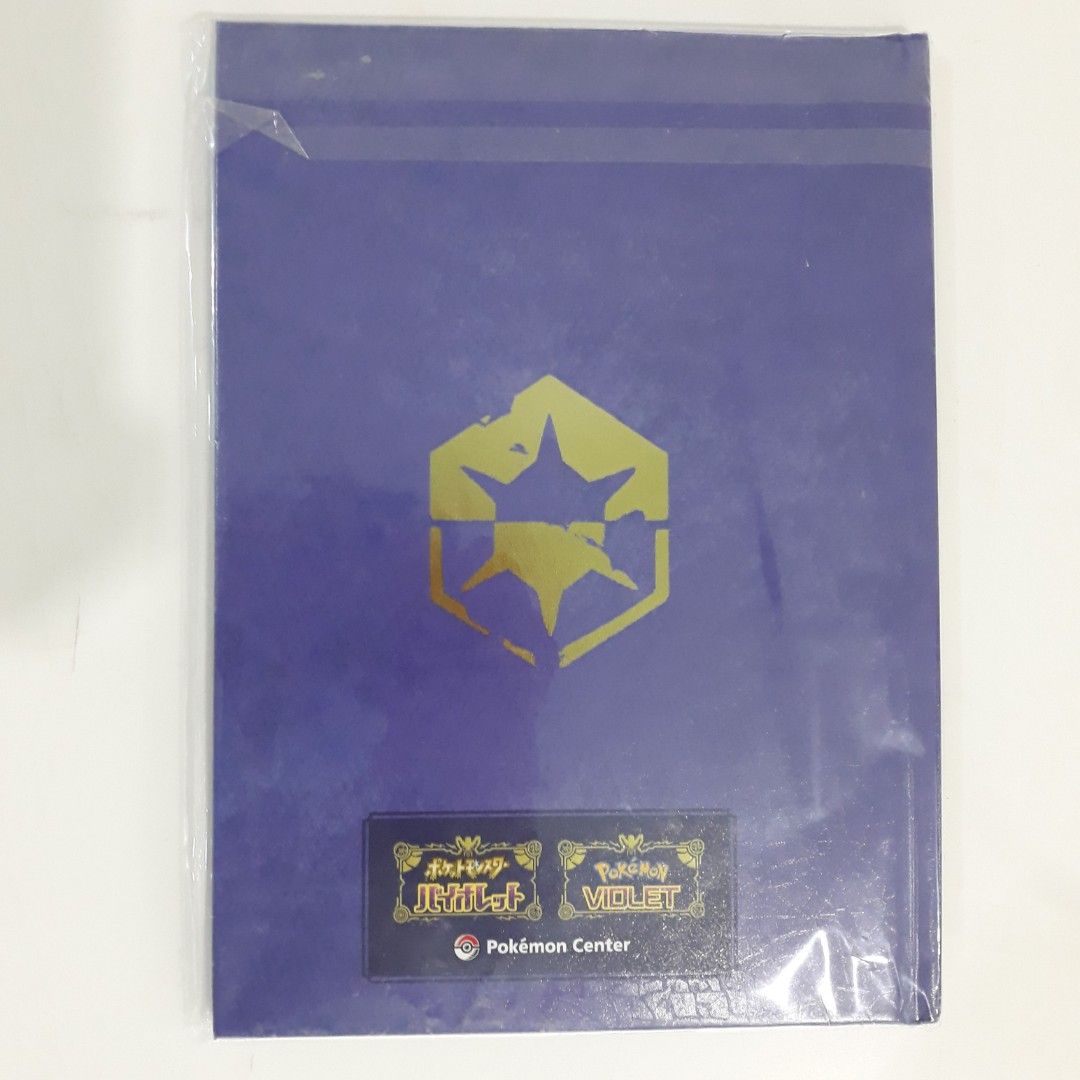 Pokemon Violet Artbook [VIOLET BOOK] (Category: Nintendo) located in Daraga. Submitted by namikazeloves (Listing ID 1207463392, Image 2). Description: Pokemon Violet Artbook [VIOLET BOOK] Included in the Pokemon Center Japanese pre-order. An imitation hard book just like the "VIOLET BOOK" Key Item in Pokemon Violet in-game. There are several artworks inside like Paldea Geography, Pokemon Designs, and Character Designs. Suited for Collection Purpo