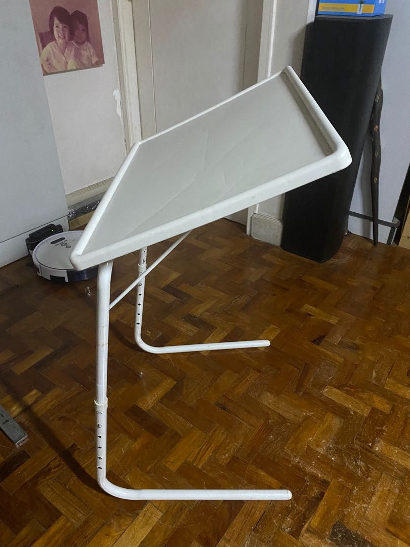 Folding TV Tray (Category: Tables & Sets) located in Quezon City. Submitted by smanalang (Listing ID 1207700592, Image 2). Description: Folding TV Dinner Tray, adjustable height and inclination. May be used as writing table, computer table, reading table, etc. A similar table sells for P814 at Shopee. I have another piece but slightly used. .