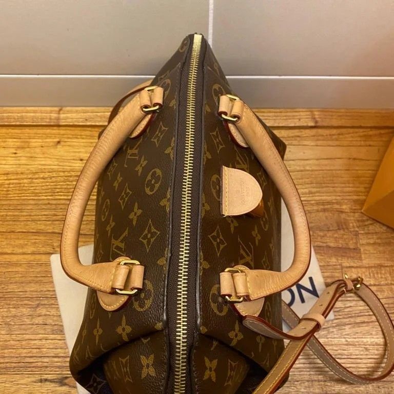 Louis Vuitton Rivoli MM, Luxury, Bags & Wallets on Carousell