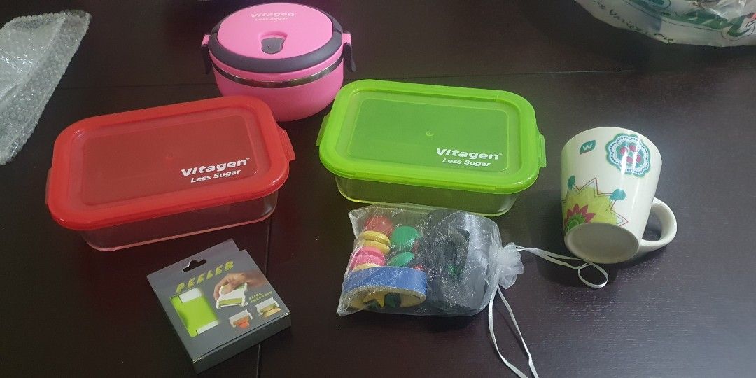 Misc stuff (Category: Water Bottles & Tumblers) located in Singapore. Submitted by alamaklynn (Listing ID 1207950772, Image 3). Description: Clearing stuff! 1) 2x Glass casserole with lid - $2 each! 2) Pink container with cover - $1 3) Cup - Sold! 4) 2 ways: Slice and Shred Peeler - $3 5) Magnets - $2 whole bag! 6) 4 x BPA free fruit juice water bottle (left 1 blue) - $2 each! 7) kitchen Multifunction Juicer - sold! 8) Milk water bottle - $2 9) T