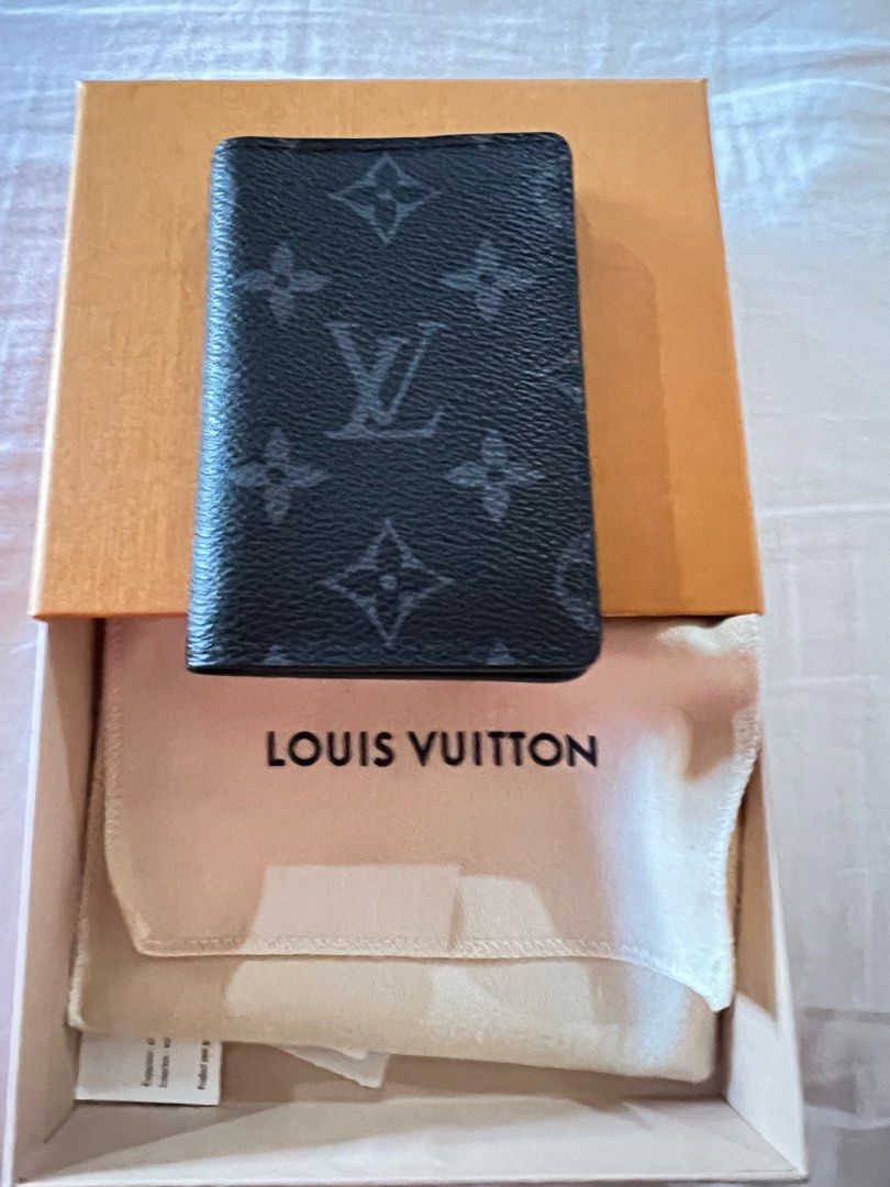 louis-vuitton pocket organizer black with blue lining. Practically unused.