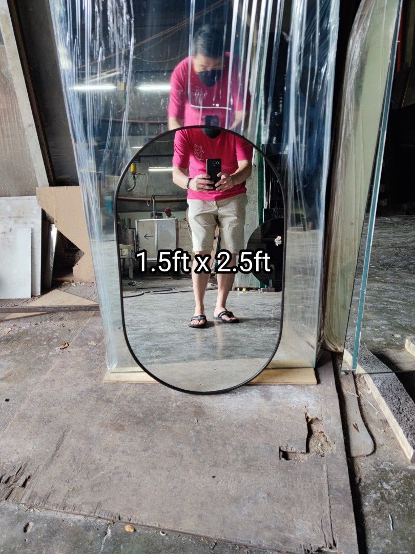 Oval Mirror (Category: Mirrors) located in Malabon City. Submitted by mirrors.ph (Listing ID 1208300288, Image 1). Description: Oval mirror with black aluminum frame and plywood backing. Using 6mm thick copper free mirror. Size: 1.5ft x 2.5ft P1012.50 Add P200 if with back hook. Available colors gold, glossy black, matte black, white and silver aluminum frame. Customize sizes and shapes are welcome..