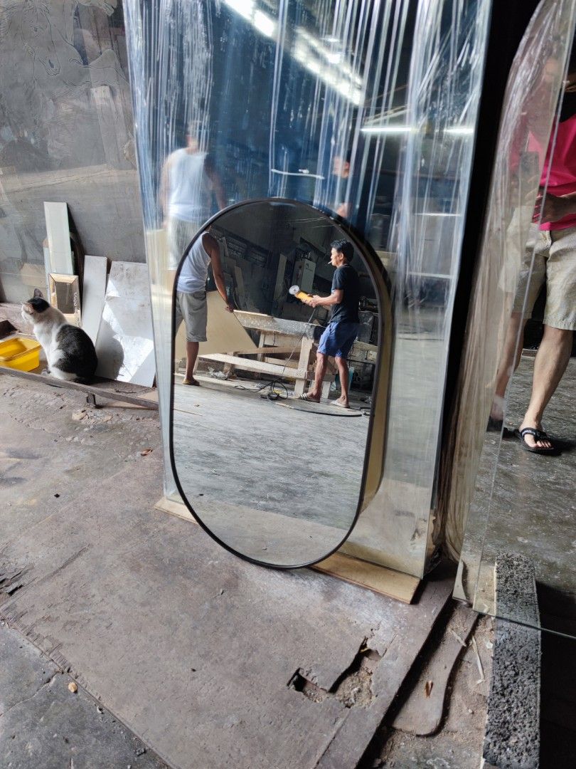 Oval Mirror (Category: Mirrors) located in Malabon City. Submitted by mirrors.ph (Listing ID 1208300288, Image 2). Description: Oval mirror with black aluminum frame and plywood backing. Using 6mm thick copper free mirror. Size: 1.5ft x 2.5ft P1012.50 Add P200 if with back hook. Available colors gold, glossy black, matte black, white and silver aluminum frame. Customize sizes and shapes are welcome..