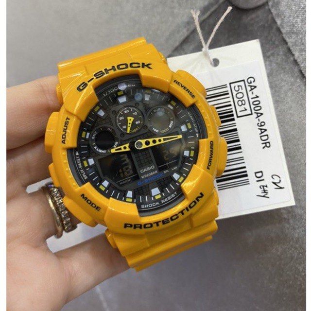 G SHOCK GA 100A 9ADR Yellow Men s Fashion Watches Accessories
