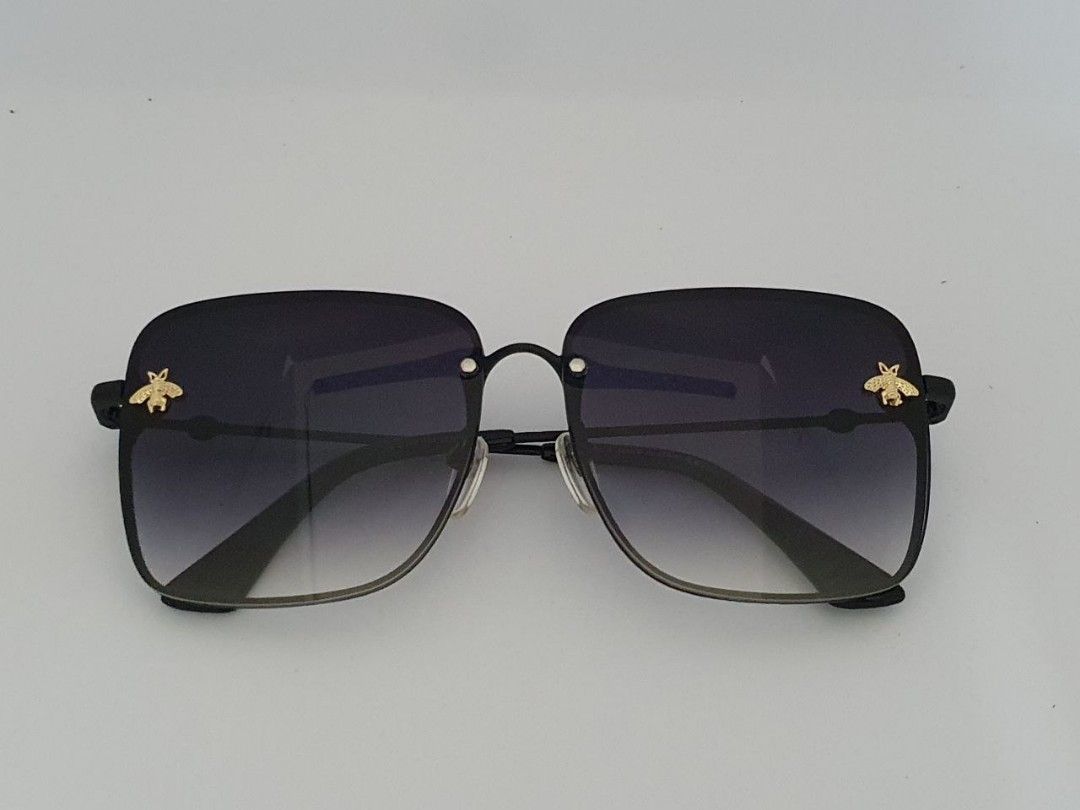 gucci sunglasses with bee in the middle
