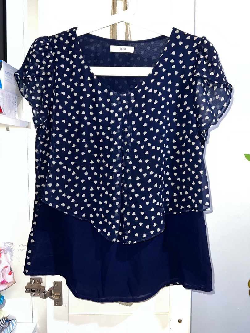 Iora Hearts Chiffon Blouse (Navy Blue) (Category: Blouses) located in Quezon City. Submitted by tinsey (Listing ID 1208601174, Image 1). Description: Non-stretch fabric With inner lining Scallop sleeves Size details Bust 32-34in Waist 28in Add Php150 for lbc shipping within Metro Manila GrabExpress delivery also an option .