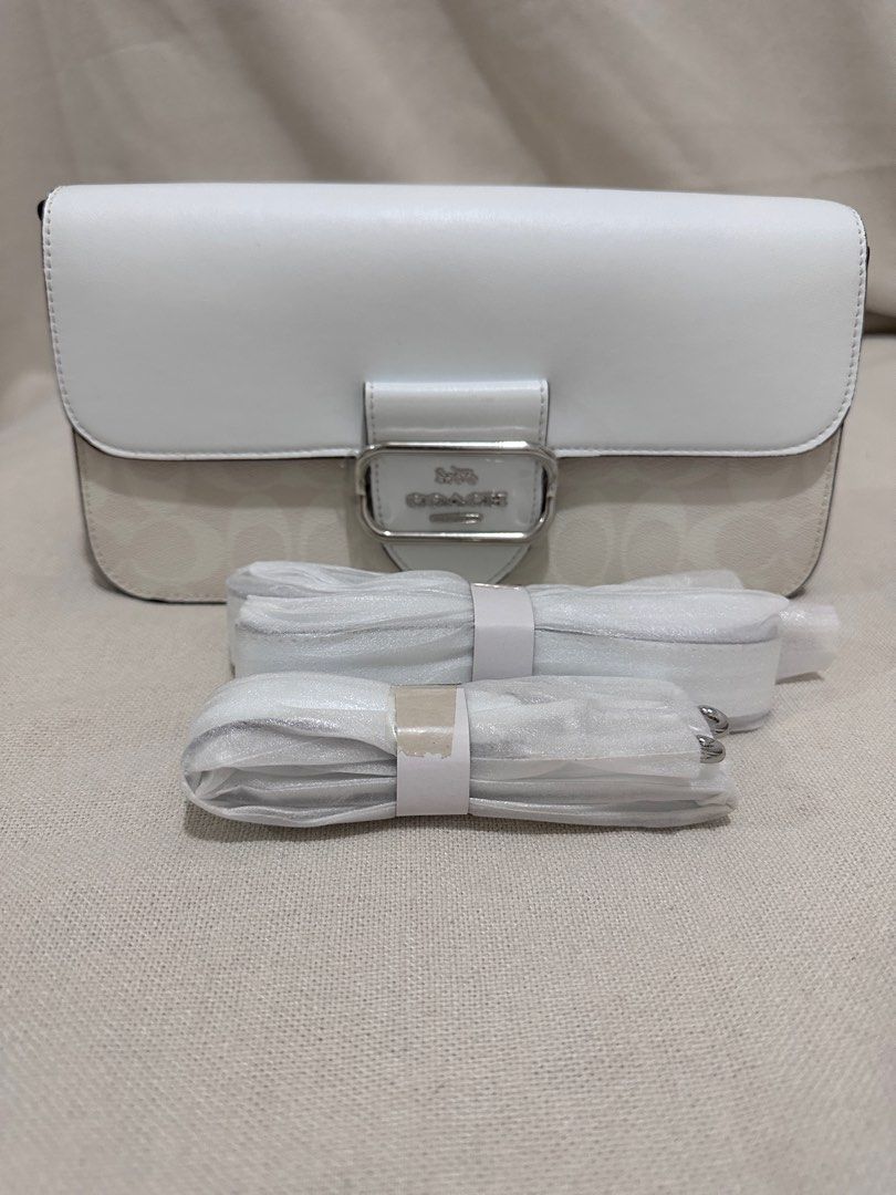 Coach Morgan in Signature Canvas (Category: Luxury Bags & Wallets) located in Santa Rosa. Submitted by Busy_Momma (Listing ID 1257764089, Image 1). Description: Signature coated canvas and smooth leather Inside zip and multifunction pockets Dimensions: 10” x 5.5” Snap closure, fabric lining Detachable handle with 9” drop Outside open pocket Detachable strap with 21 1/4” drop for shoulder or crossbody wear 10 1/2” (L) x 5 1/2” (H) x 2 1/2” (W).