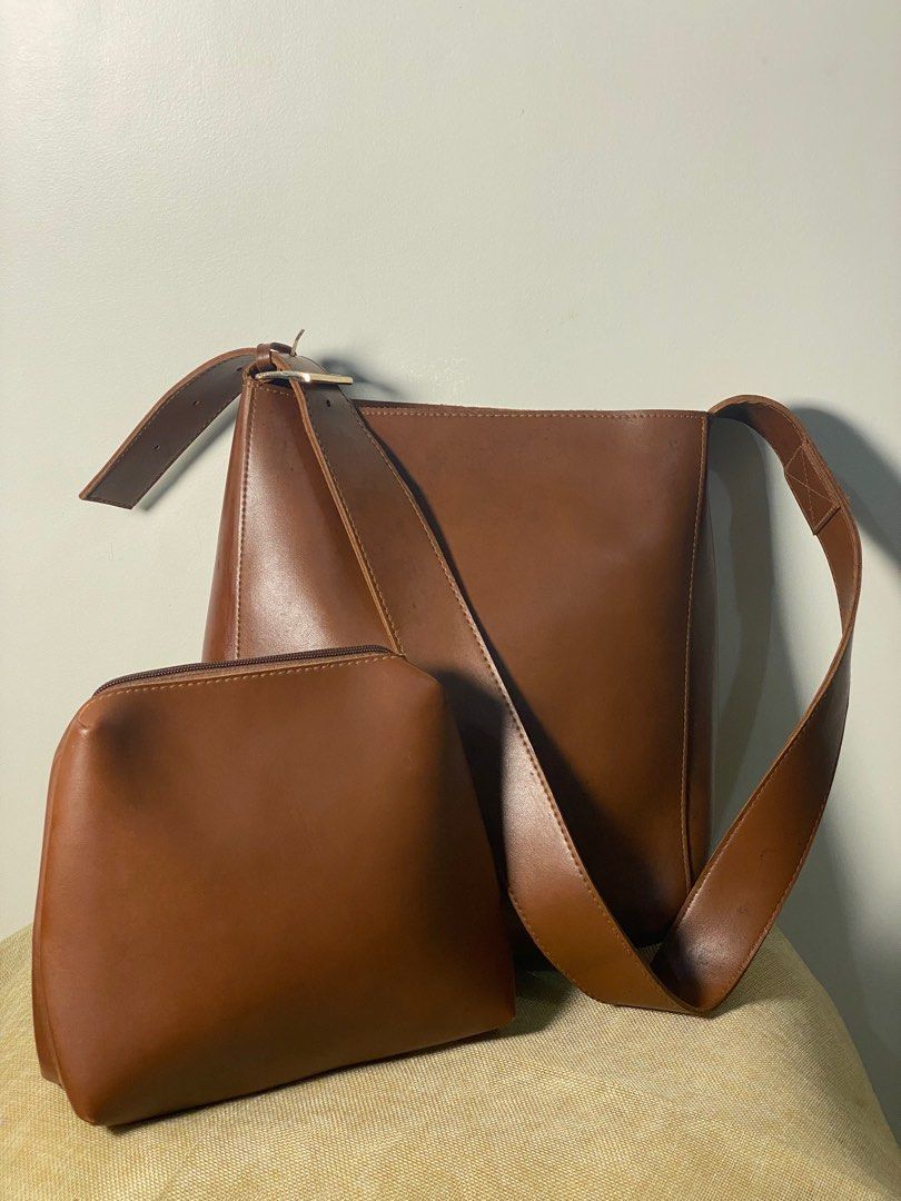 Large Brown sling bag with pouch (Category: Cross-body Bags) located in Cabanatuan. Submitted by tcdeclutters (Listing ID 1257843952, Image 1). Description: Preloved brown leather large sling bag with large pouch - good quality leather - no major flaws For only Php 350.