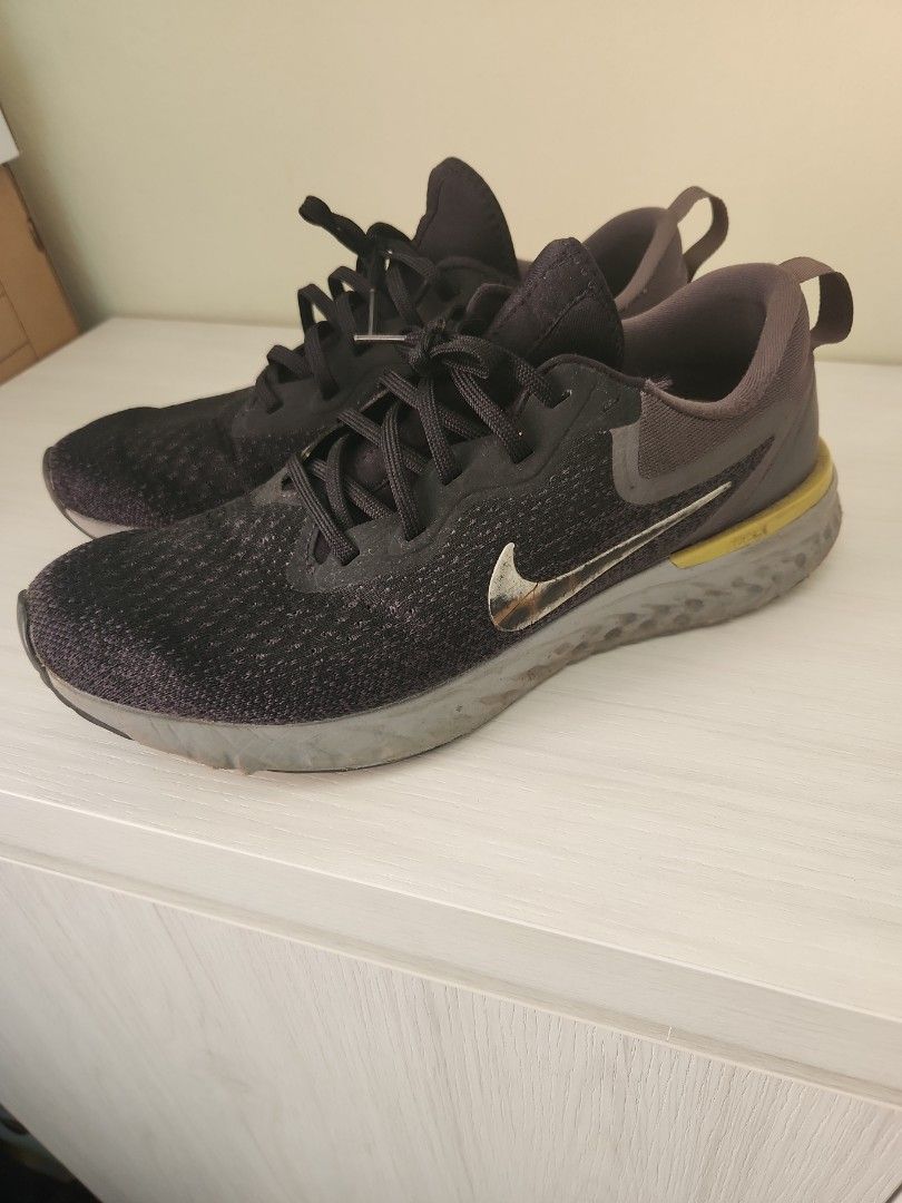 Nike odyssey react black and gold sale