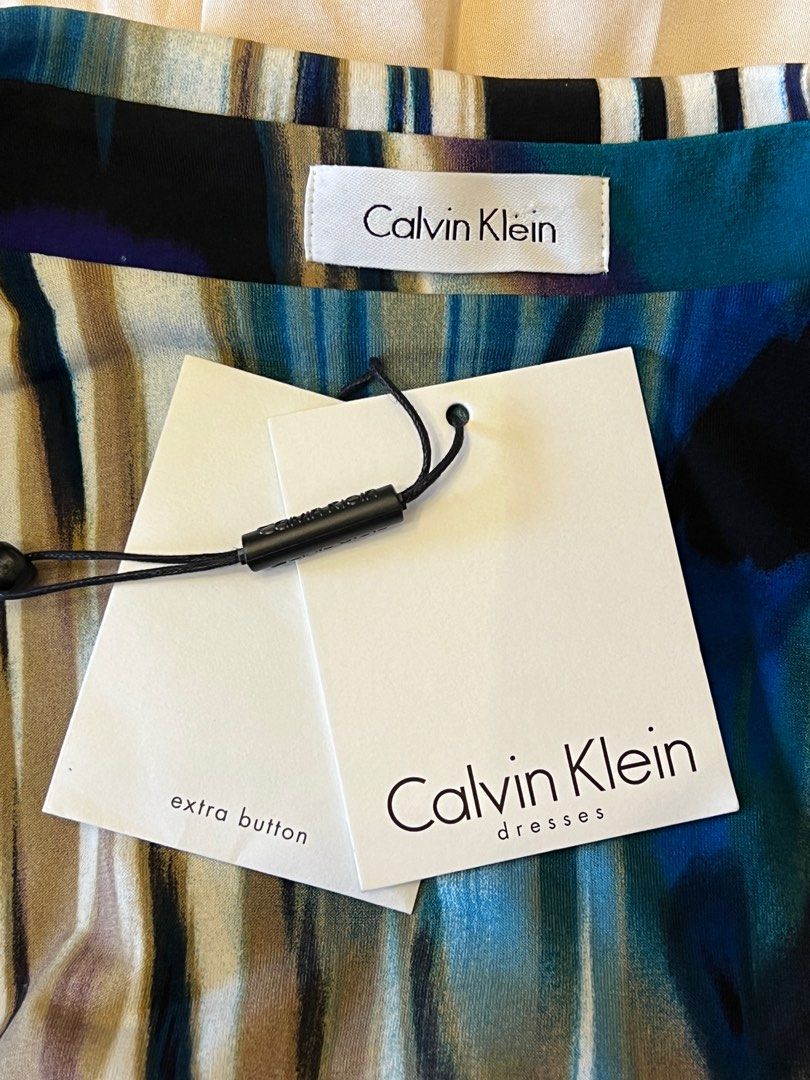 Calvin Klein Wrap Dress Size 6 (Category: Dresses) located in Quezon City. Submitted by projectprelovedreloved (Listing ID 1259358559, Image 2). Description: Calvin Klein Wrap Dress Size 6 Brand new. Authentic. Bought in the USA. Very flattering and classy. Comes with tag and extra buttons. Size 6 (See size guide in the photos. Price P3,000 Pick up from Cubao, Quezon City RFS Decluttering Posted in other groups.