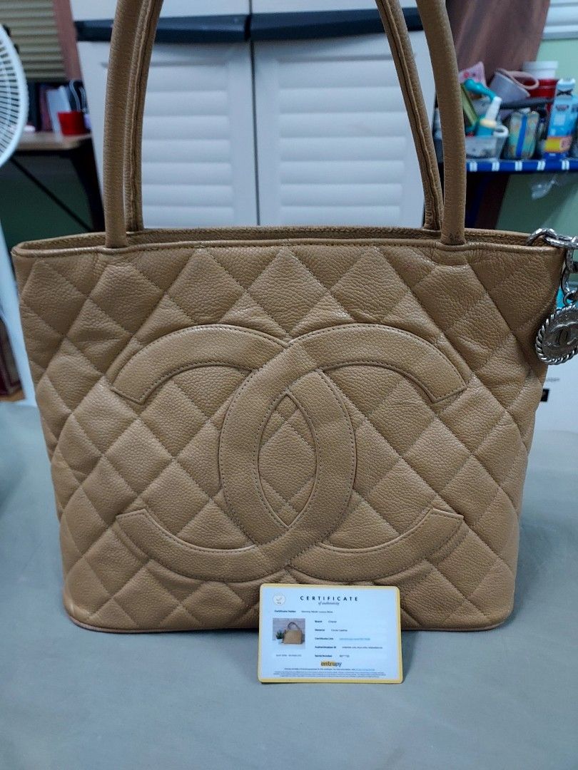 Chanel Medallion (Category: Luxury Bags & Wallets) located in Paranaque City. Submitted by andim8 (Listing ID 1259329930, Image 1). Description: Chanel medallion guaranteed authentic in dark beige silver medallion entrupy cert card included slightly nego.