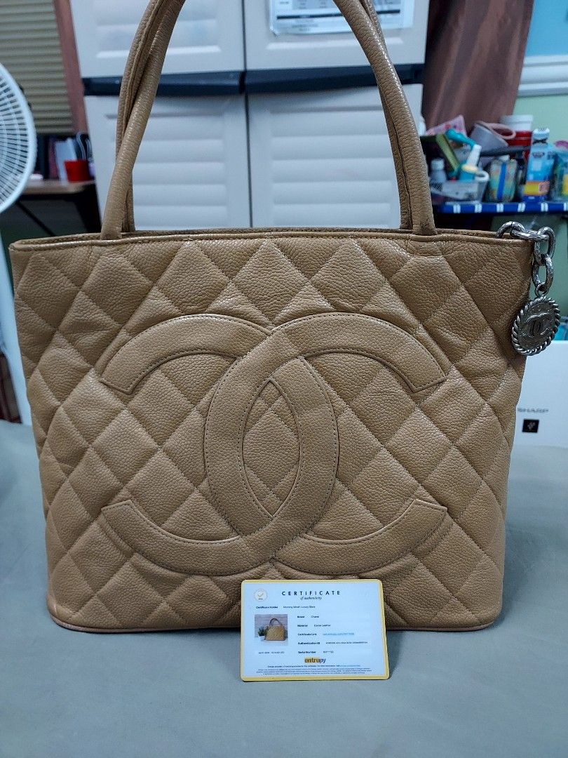 Chanel Medallion (Category: Luxury Bags & Wallets) located in Paranaque City. Submitted by andim8 (Listing ID 1259329930, Image 2). Description: Chanel medallion guaranteed authentic in dark beige silver medallion entrupy cert card included slightly nego.