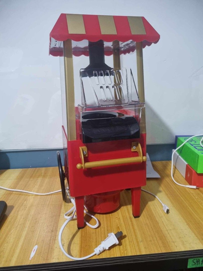 Popcorn Maker (Category: Other Kitchen Appliances) located in Manila. Submitted by redonlineshop (Listing ID 1259434200, Image 3). Description: Popcorn Maker ₱1050 Material: Plastic Size: 41cm x 25cm x 22cm Electric air-pop type popcorn maker Makes oil-free popcorn in 5 mins Space-saving and portable design ON HAND BRAND NEW Mode of Payment: Gcash,COD Same day delivery + Delivery Fee.
