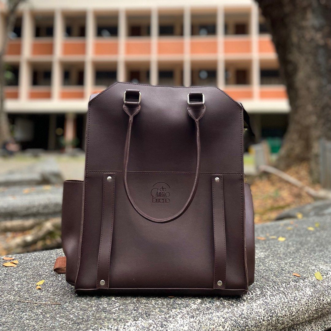 Straightforward Leather Bag (Category: Backpacks) located in Marikina City. Submitted by 1800shelves (Listing ID 1259321941, Image 2). Description: CLEARANCE SALE Three-way Leather Backpack From the makers of Straightforward! Only for PHP 850 Available in two-tone and classic dark brown. Features: 1. Three-way: can be worn as a backpack, tote bag or handbag 2. Vegan leather: durable, water-resistant 3. Multiple compartments - side pockets, laptop