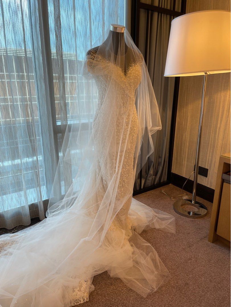 Two-way Asymmetrical Wedding gown for rent (Category: Evening dresses & gowns) located in Makati City. Submitted by cheichic (Listing ID 1208835615, Image 1). Description: Available for rent: message me for details I am selling this as well, message me for the price. Mark Brides Two-Way Asymmetrical Wedding Gown used once last March 2022. This is really beautiful and stunning in person. Half beaded embellished with swarovski. Materials: lace and 