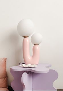 Aesthetic modern pink bedside lamp.