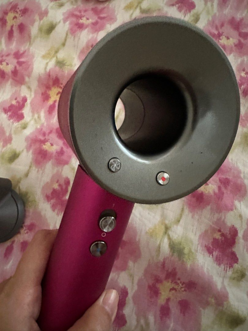 Dyson Hairdryer (Category: Hair) located in Binangonan. Submitted by mkcdeclutter (Listing ID 1259456163, Image 2). Description: BEWARE OF FAKES!! Selling low - Bought from a carouseller for 11k 100% authentic Dyson Supersonic Hair Dryer special gift edition Condition: 9/10 No box and brush 2 attachments included 220V.