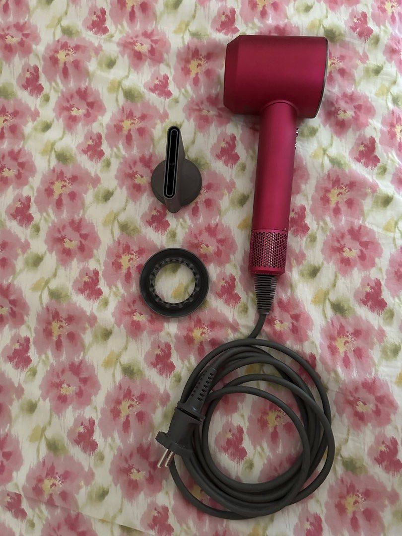 Dyson Hairdryer (Category: Hair) located in Binangonan. Submitted by mkcdeclutter (Listing ID 1259456163, Image 1). Description: BEWARE OF FAKES!! Selling low - Bought from a carouseller for 11k 100% authentic Dyson Supersonic Hair Dryer special gift edition Condition: 9/10 No box and brush 2 attachments included 220V.