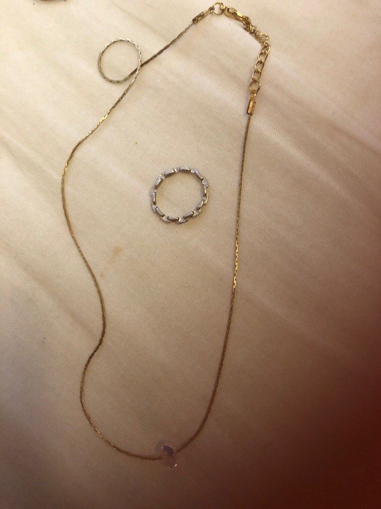 Gold necklace with ring best sale