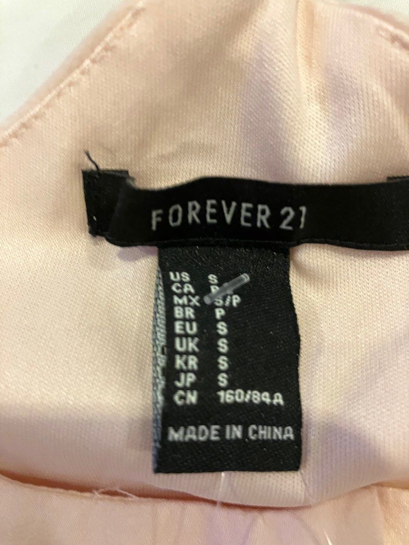 Forever 21 bodysuit - blush/peach color (Category: Others Tops) located in Quezon City. Submitted by attemptingtodeclutter (Listing ID 1259662745, Image 2). Description: Bought In the US.
