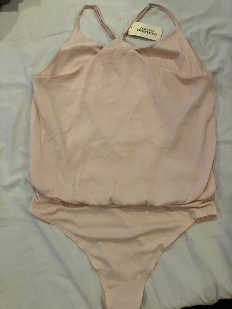 Forever 21 bodysuit - blush/peach color (Category: Others Tops) located in Quezon City. Submitted by attemptingtodeclutter (Listing ID 1259662745, Image 3). Description: Bought In the US.
