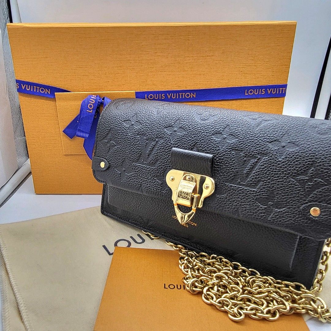 Shop Louis Vuitton MONOGRAM EMPREINTE Vavin chain wallet (M67839