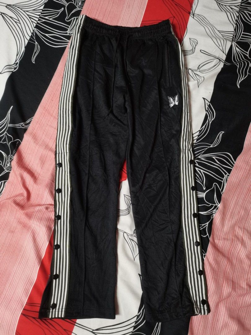 Needles track pants (Category: Joggers) located in Apalit. Submitted by _doer (Listing ID 1259728193, Image 1). Description: Size 28 to 30 LENGTH 35.5 No flaws.