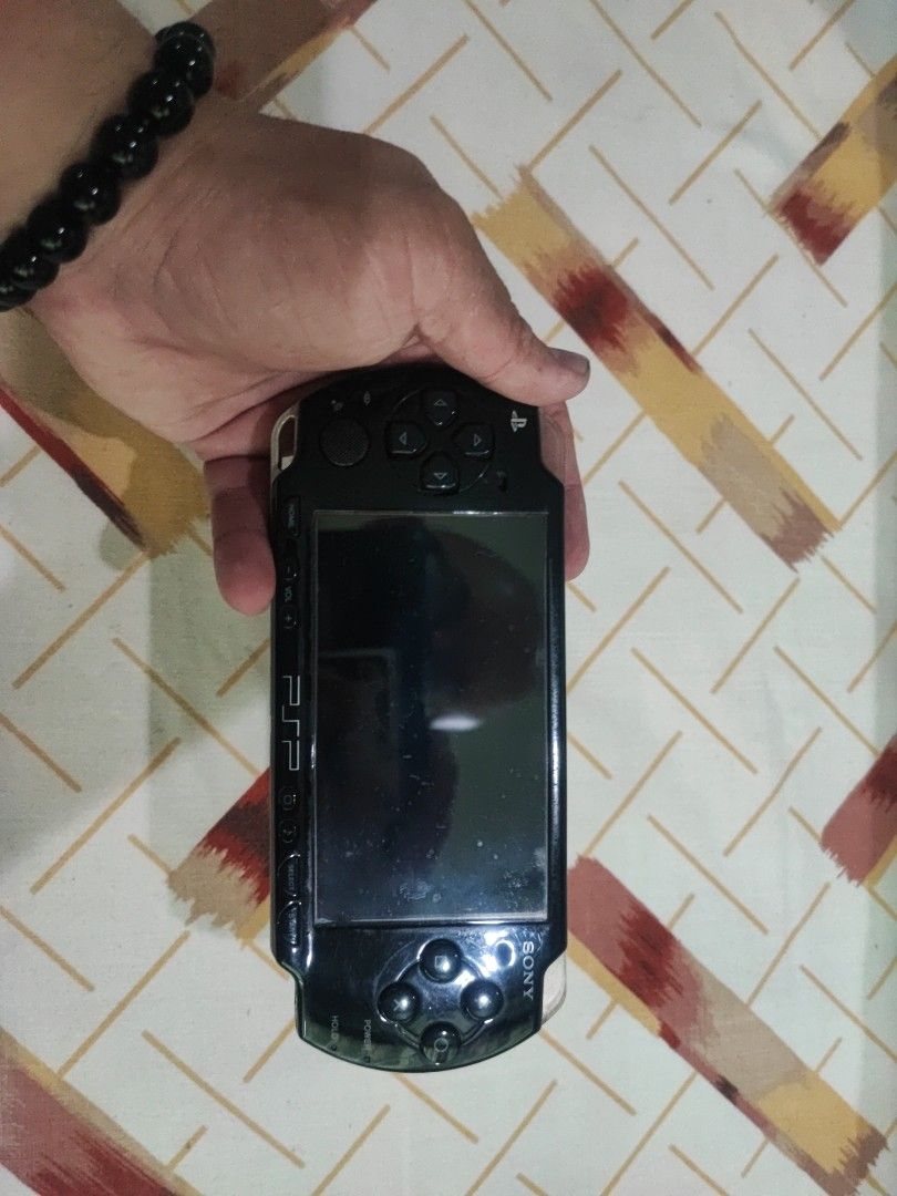Selling psp 2000 (Category: PlayStation) located in Quezon City. Submitted by wilhelm1990 (Listing ID 1259666950, Image 3). Description: Selling my psp 2000 still works plugged in. with case and memory cards with games already. Jailbreak. with original charger. you can play it or use it for spare parts no parts was replaced on this unit. No battery. It is sold as a set. Will add another old console in my collection if found add appropriate price 