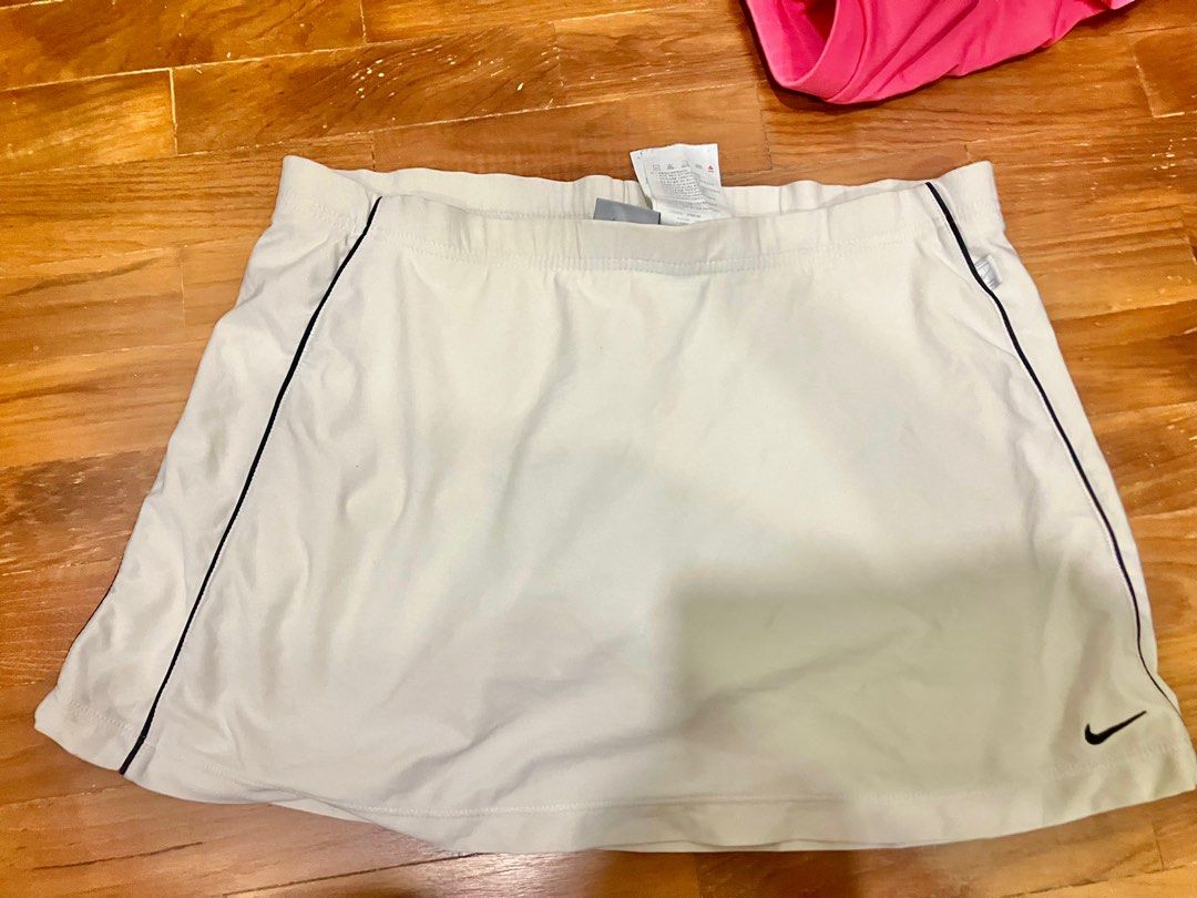 White Nike and pink adidas tennis skirts